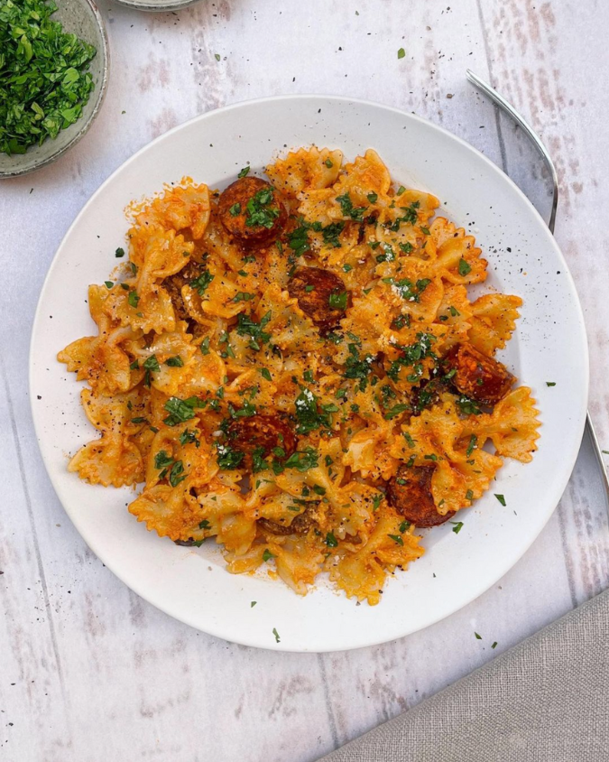 Farfalle pasta with fried chorizo sausage tossed with blended butternut squash and topped with fresh chopped parsley | Dinner Categories Recipes