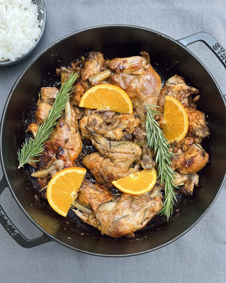 a black casserole with chicken pieces with orange and rosemary & All Recipes Category