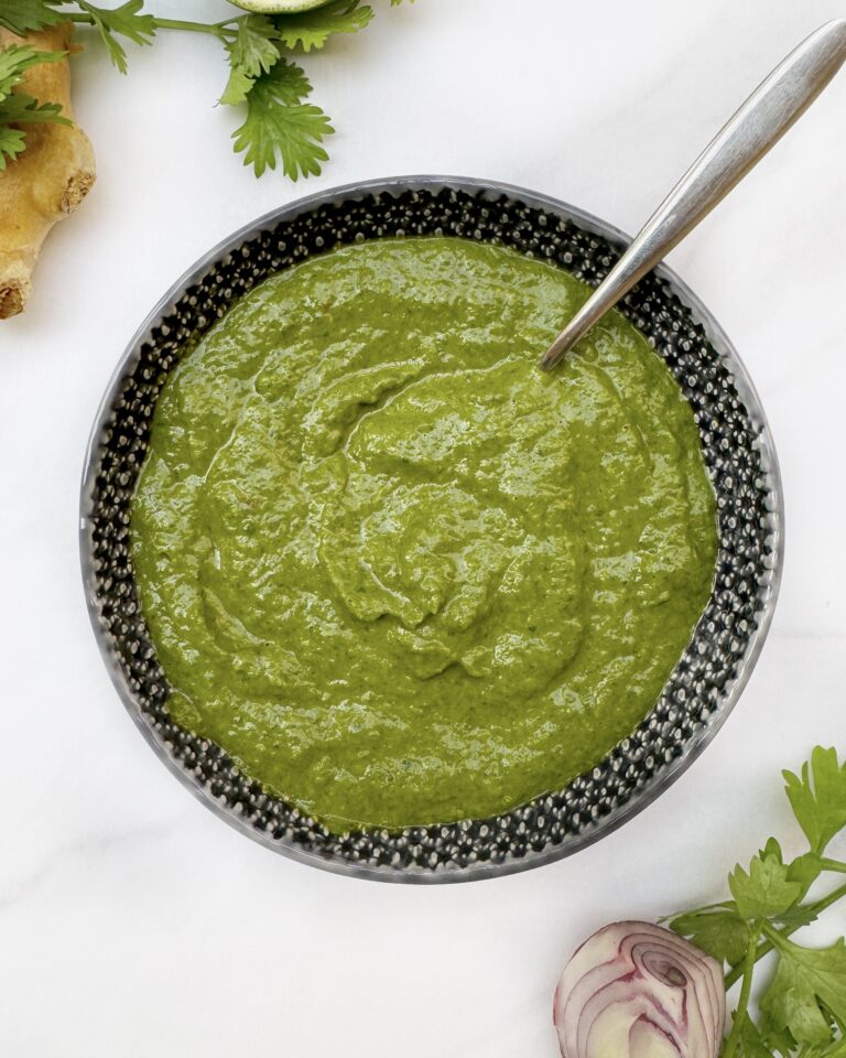 Thick and smooth green sauce in a dark grey bowl | Spice It Up Category | Sauces