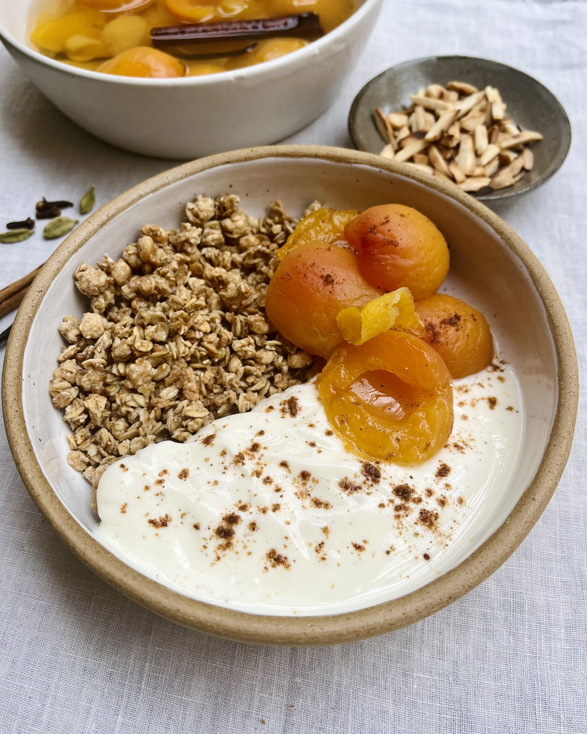 poached apricots over yoghurt and granola