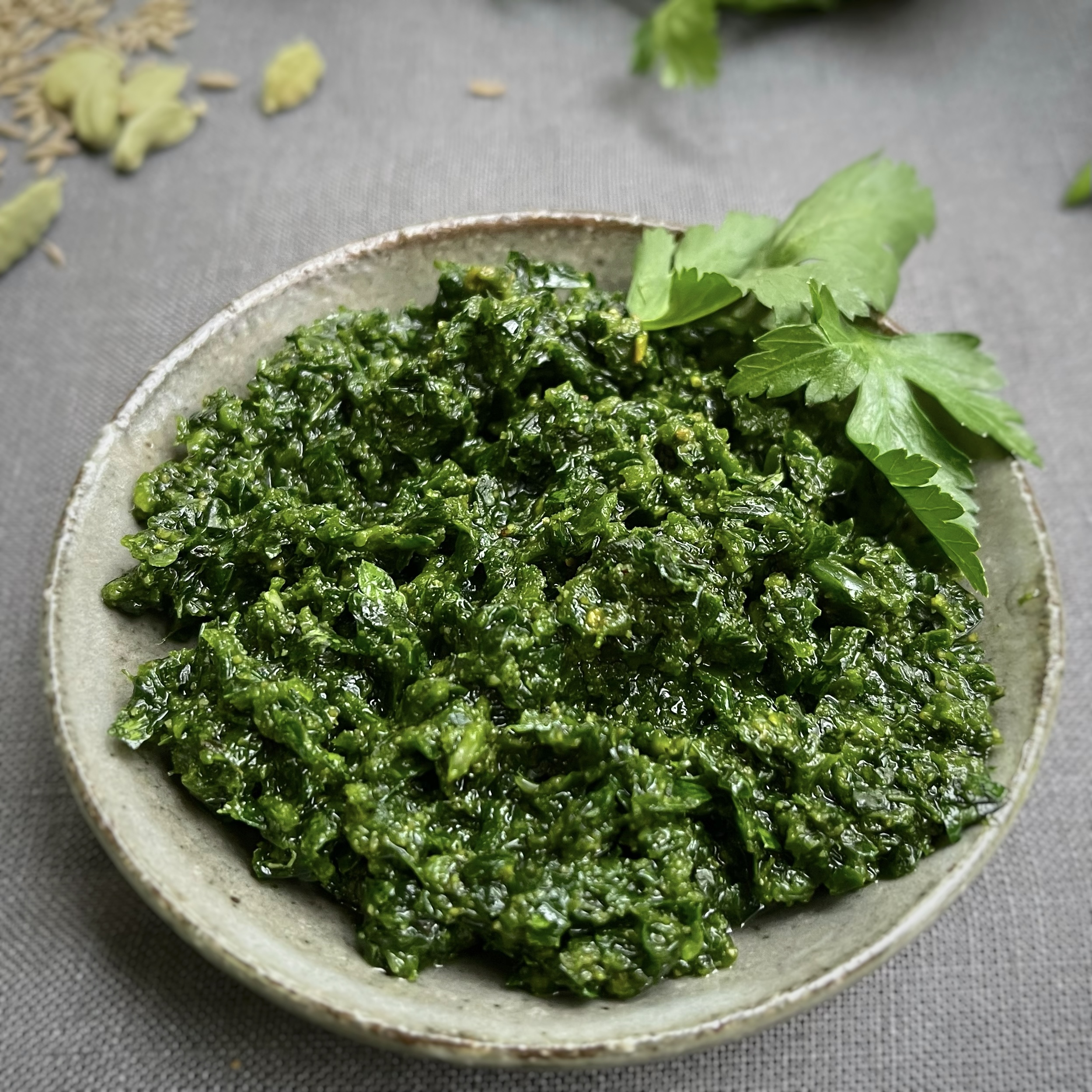 zhoug, yemeni condiment made from parsley, coriander, garlic, chilies, cardamom and cumin