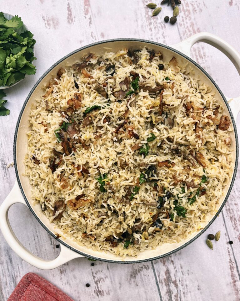 a casserole of biryani rice with lamb and eggplant