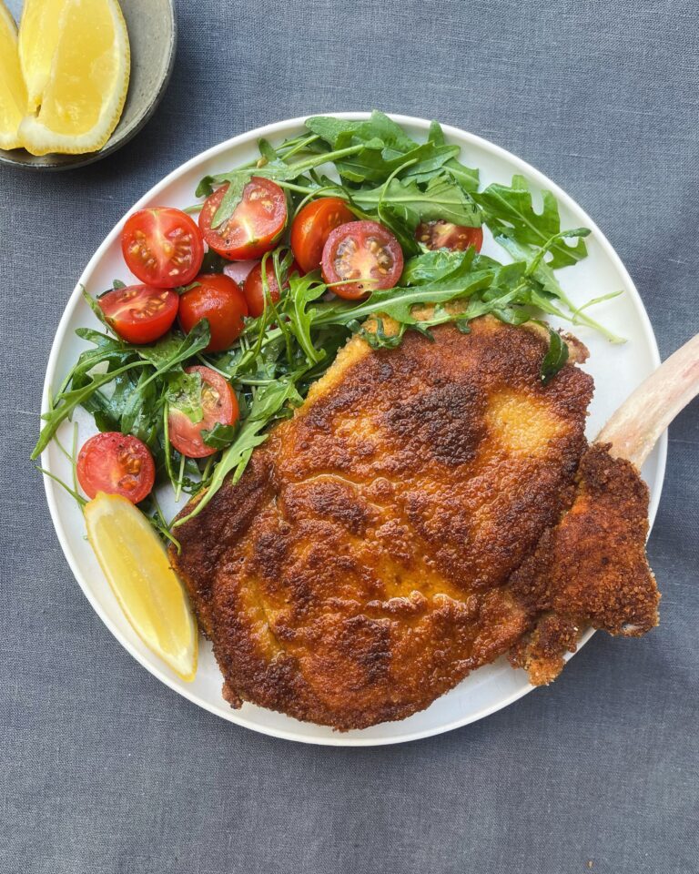 veal milanese - whole breaded veal chop pan fried until golden