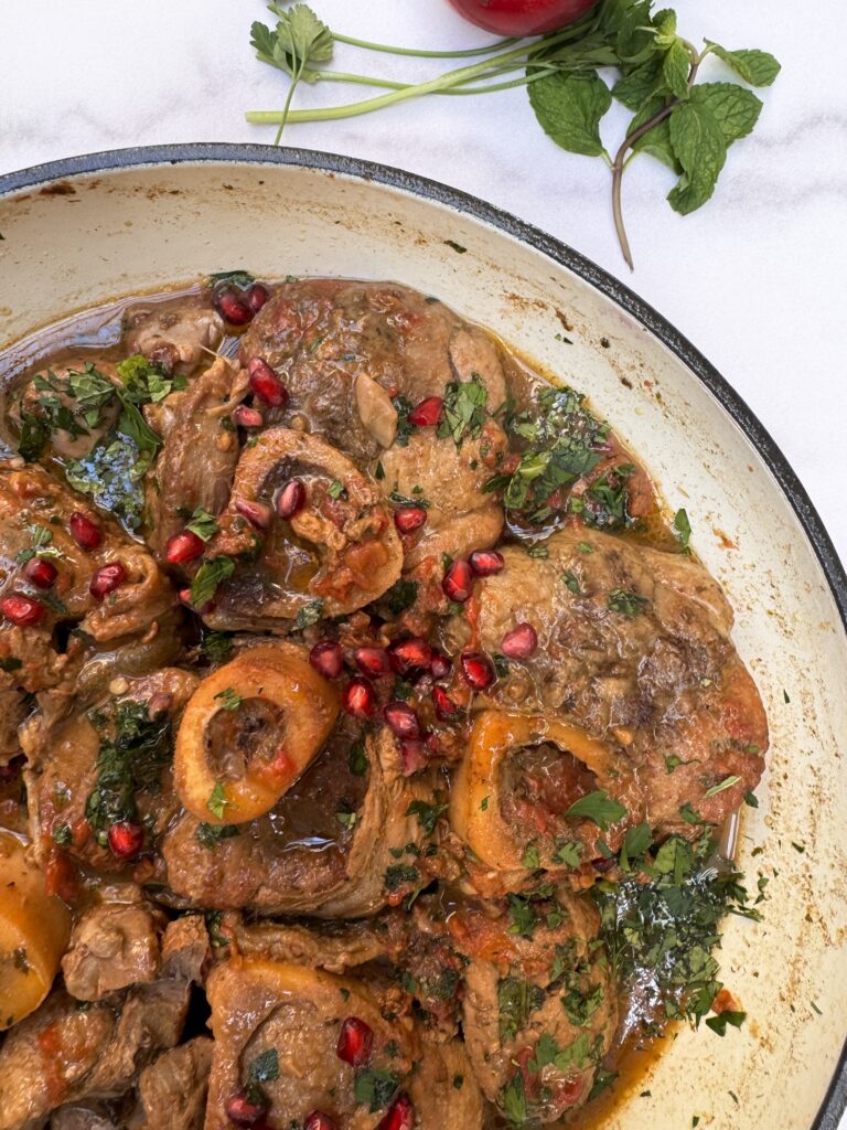 braised veal shanks with tkemali and tomatoes