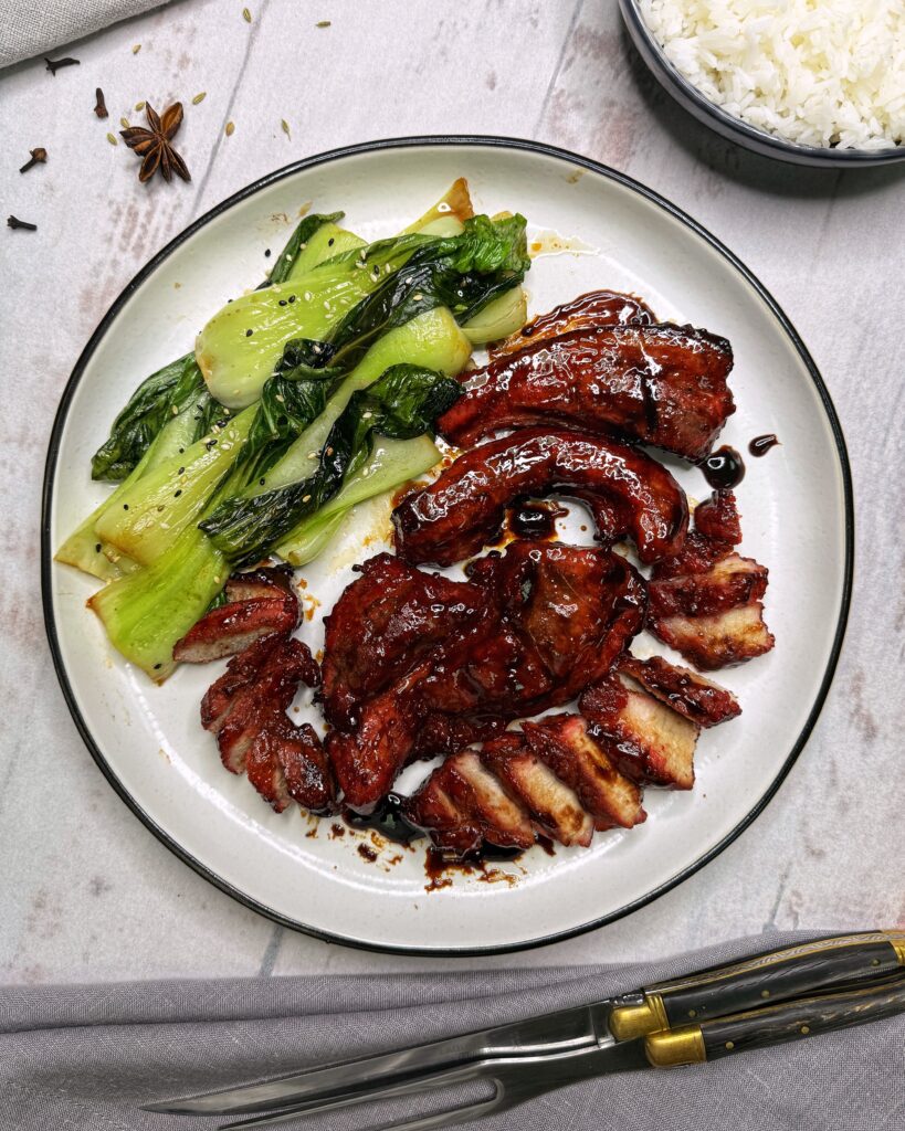 char siu, chinese bbq pork, strips of pork belly in a sticky brown-red glaze made with char siu sauce