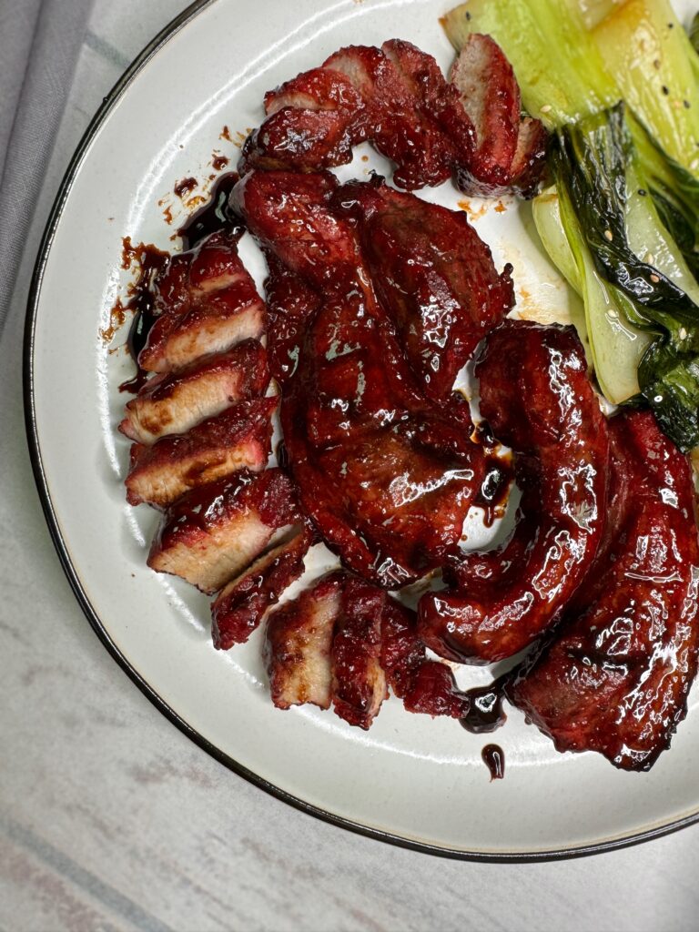 char siu, chinese bbq pork, strips of pork belly in a sticky brown-red glaze made with char siu sauce 