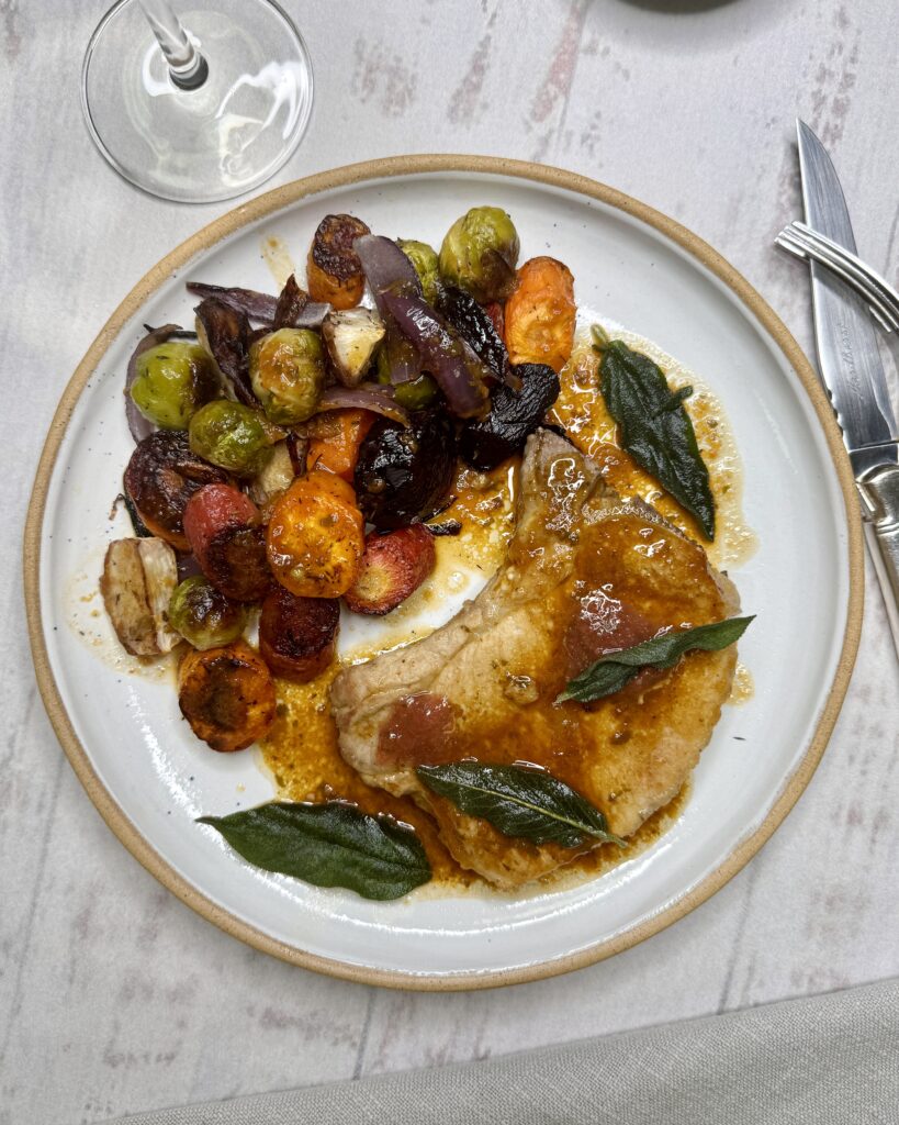 fried Pork Chops with brown gravy crispy sage leaves and roasted vegetables