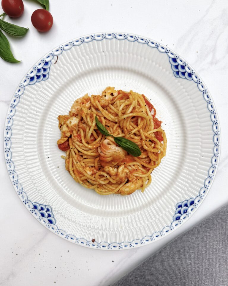 Lobster pasta - speghetti tossed in red tomato sauce with chunks of lobster tail