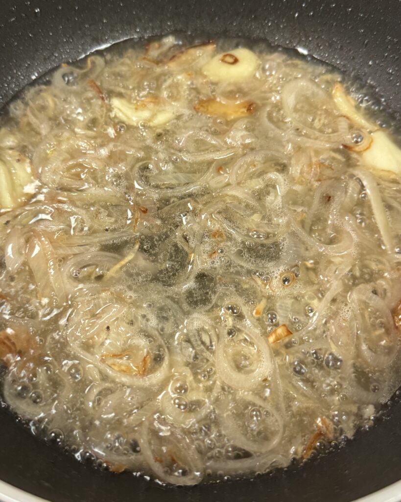 shallots and garlic simmering in white wine