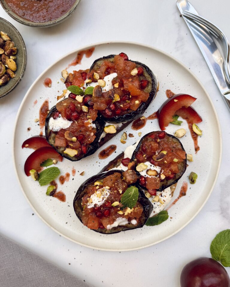 Toast with fried eggplant, plums, burrata pistachios and tkemali sauce