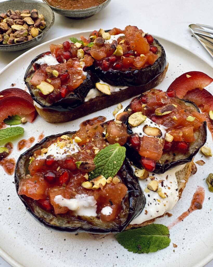 fried eggplant toast with diced tomatoes and burrata