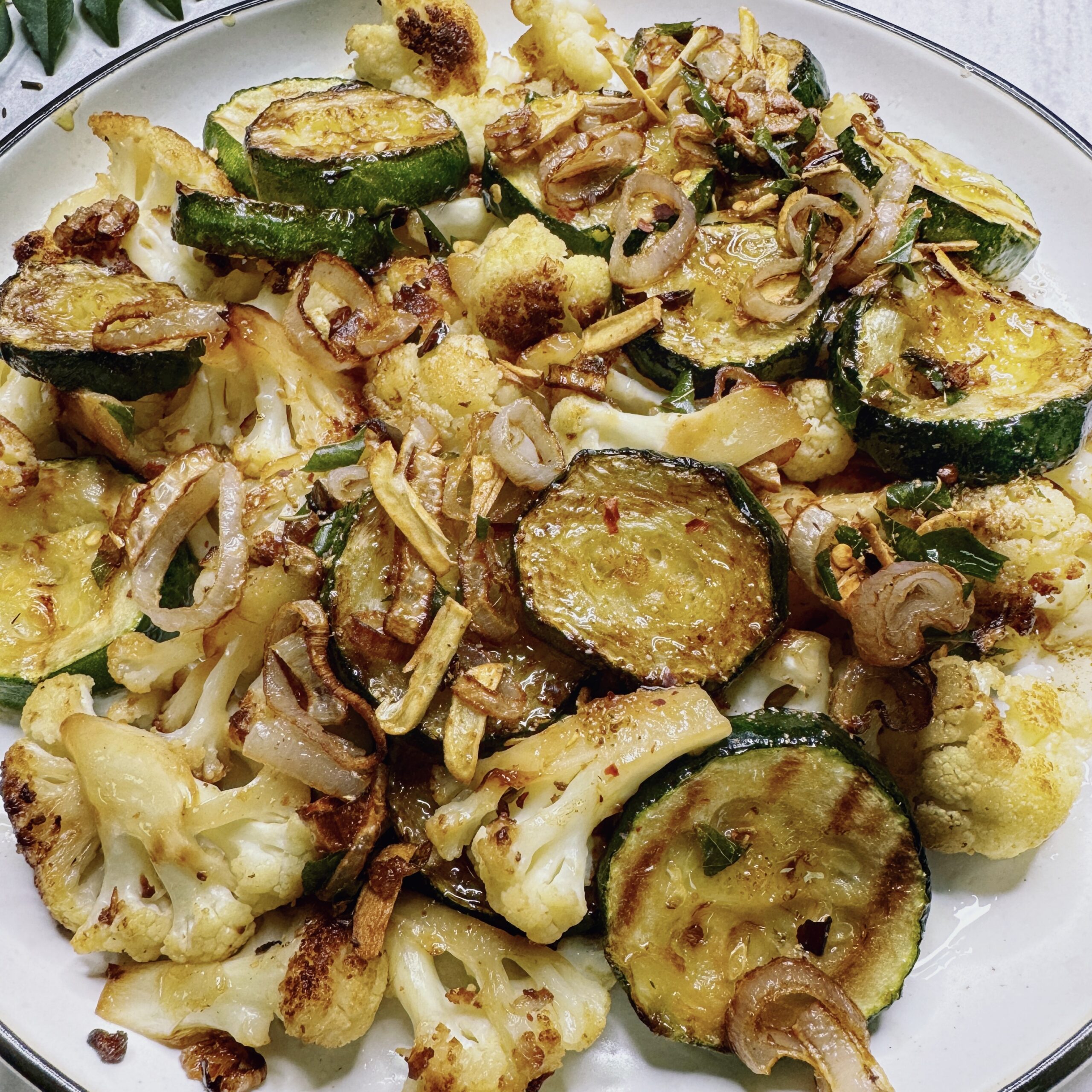 fried cauliflower and zucchini with tempered spices and aromatics