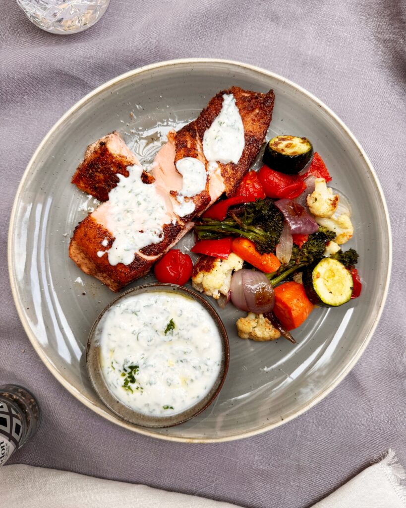 Salmon fillet in baharat spice crust with yoghurt and roasted vegetables