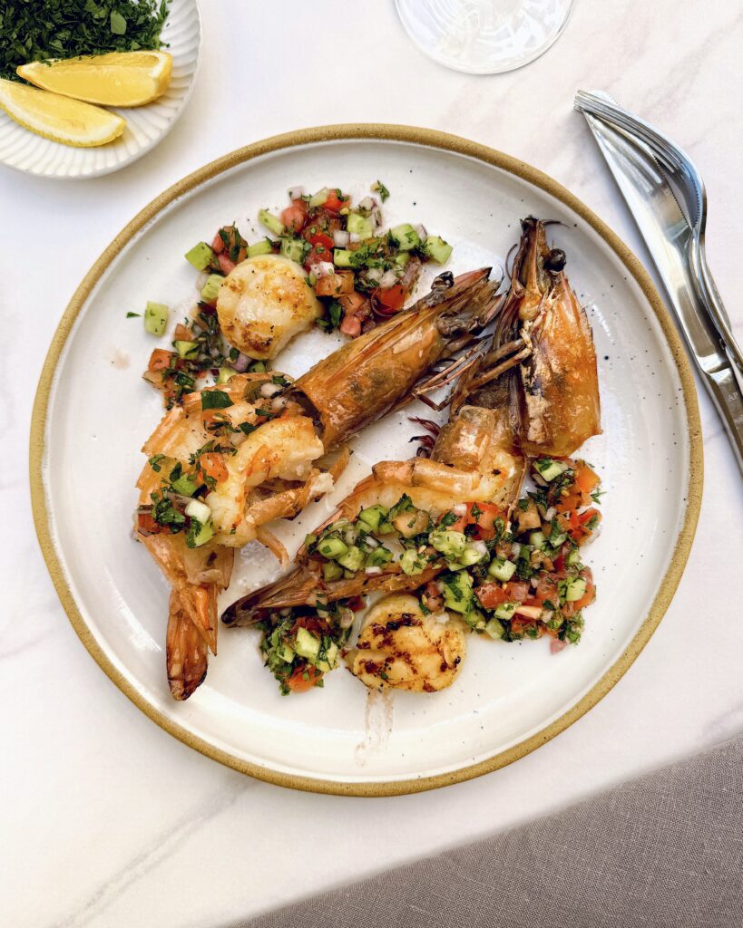 Pan fried large prawns with heads on topped with tabbouleh salad