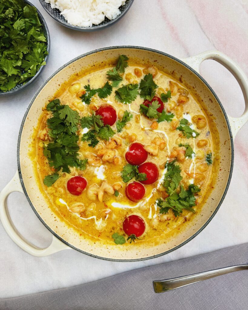 Thai yellow coconut curry with prawns and cherry tomatoes