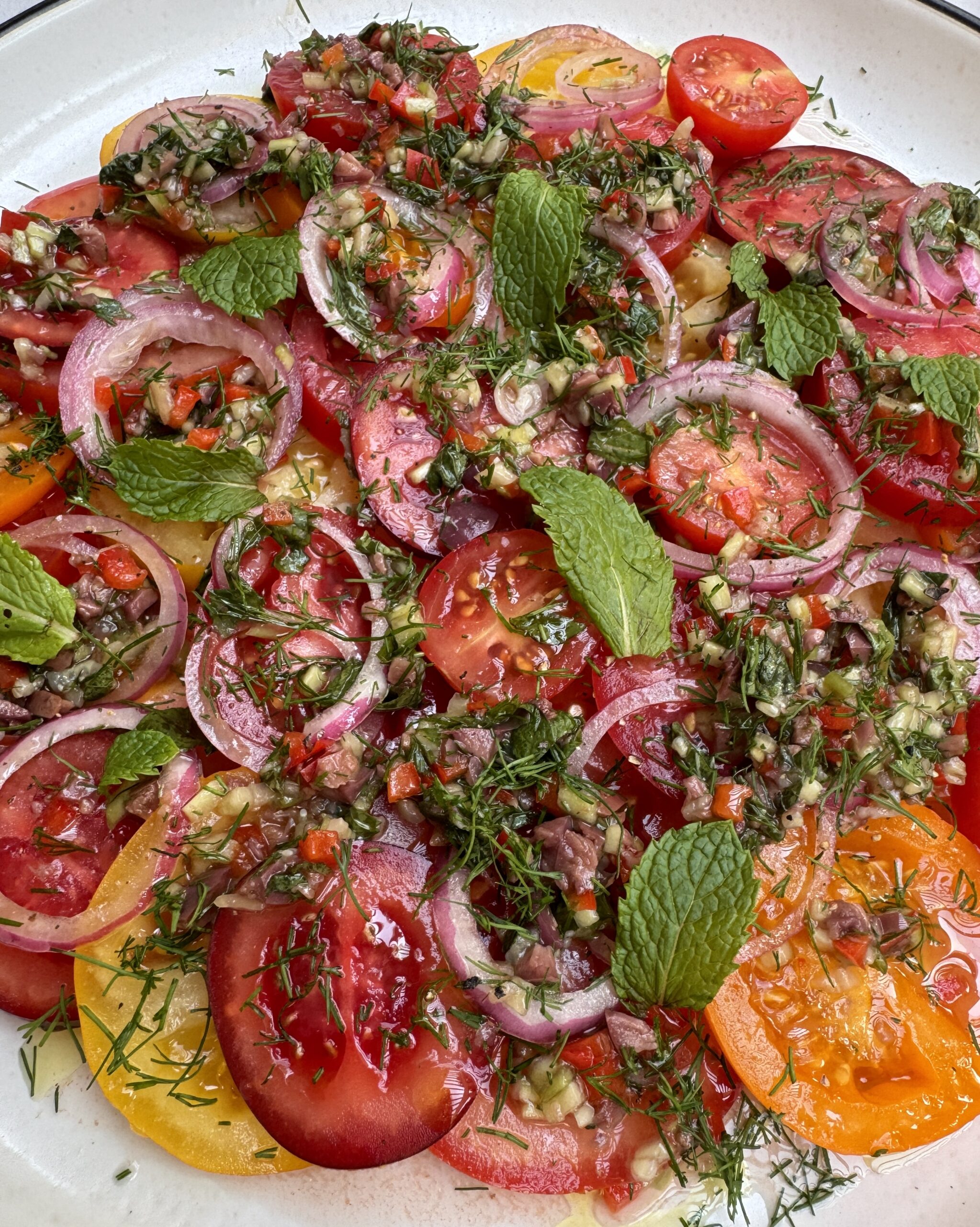 tomato carpaccio with marinated onion and cucumber salsa