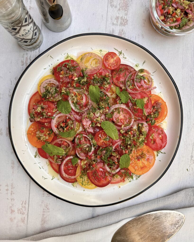 tomato carpaccio with cucumber salsa and marinated onion