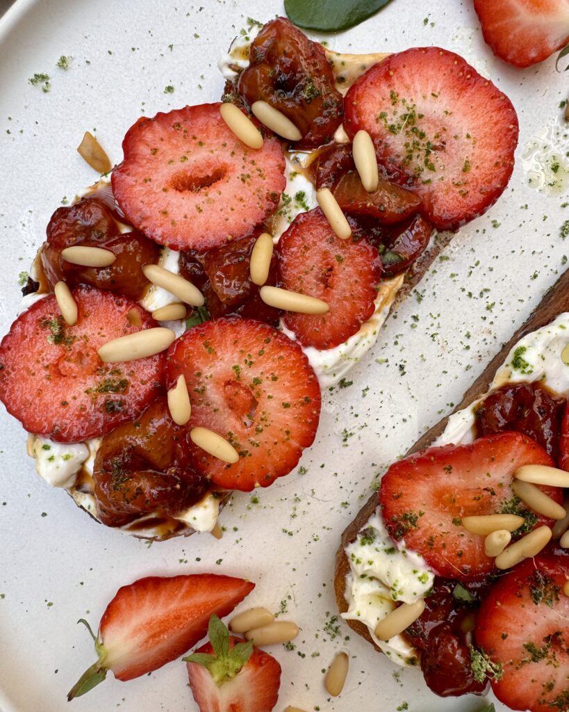 Grilled sourdough toast with whipped ricotta, makrut lime sugar and strawberries