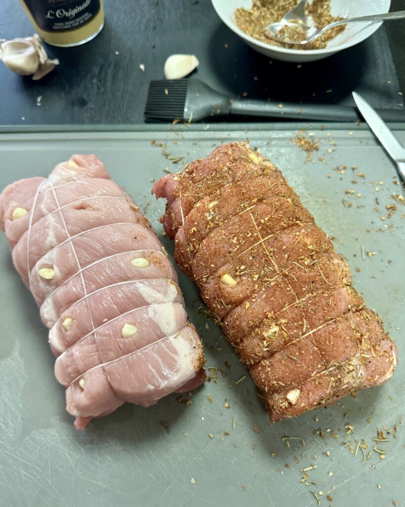 pork shoulder with a rub in preparation of cold pork roast