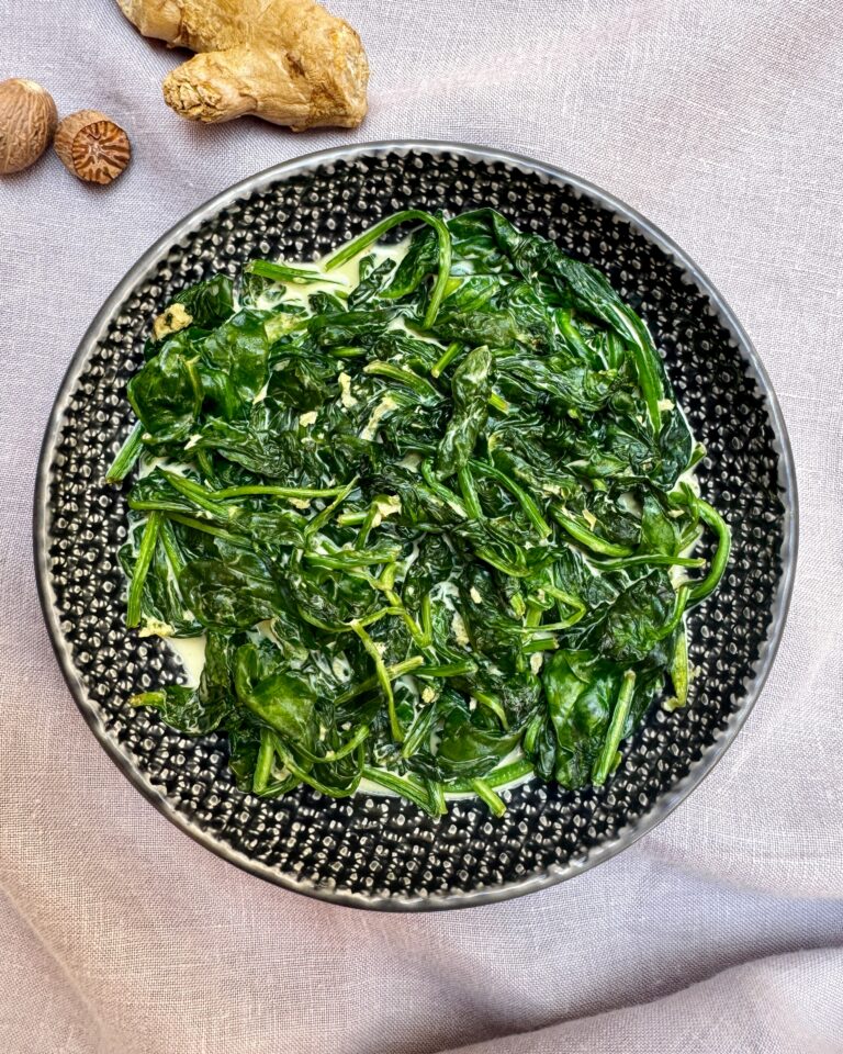 A plate with Creamy Spinach with Nutmeg and Ginger