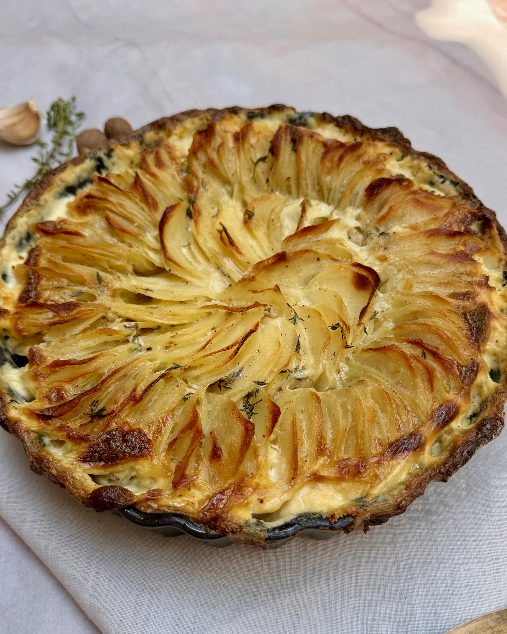 Dauphinoise potatoes with nutmeg, thyme and white pepper with golden edges