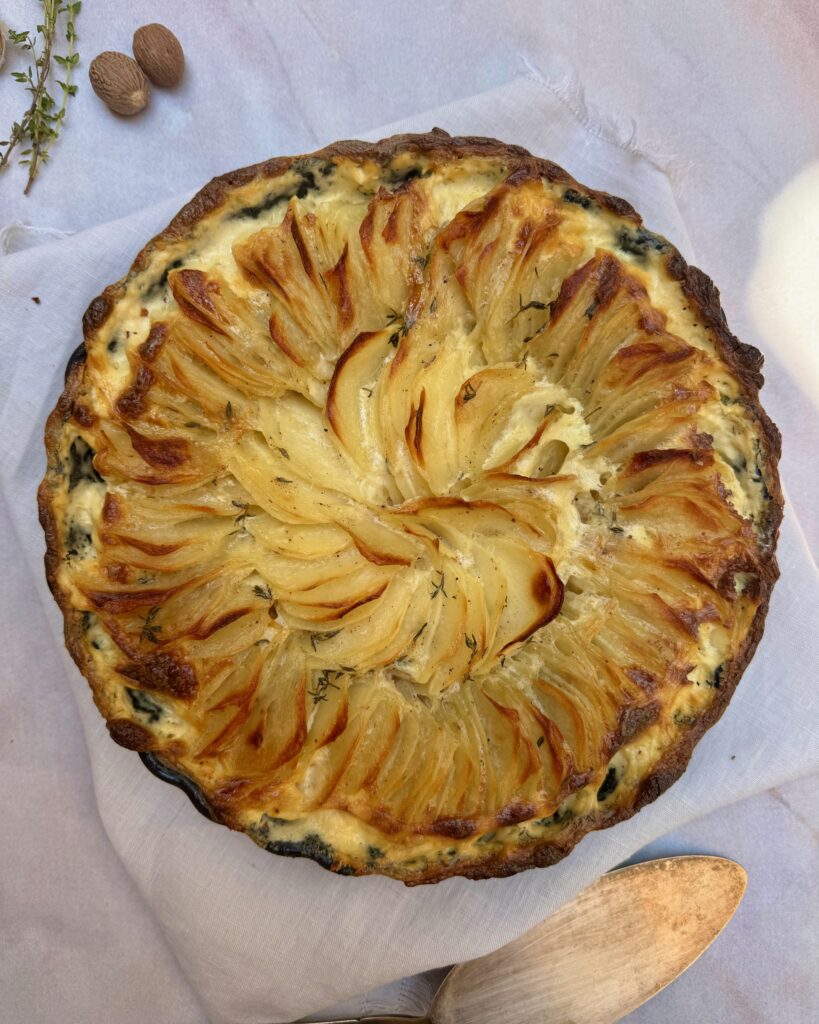 A dish with Dauphinoise potatoes with golden edges