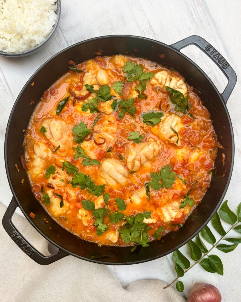 white fish stew in tomato sauce with coriander leaves