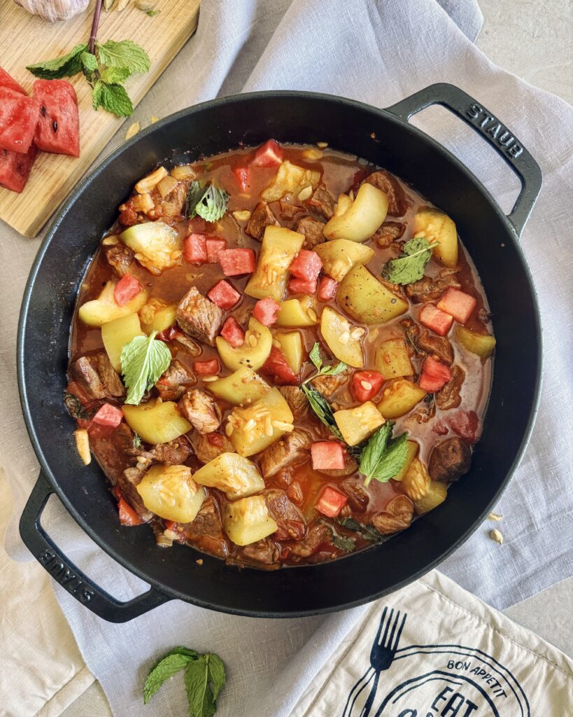 lamb stew with watermelon, tomatoes and green pumpkin