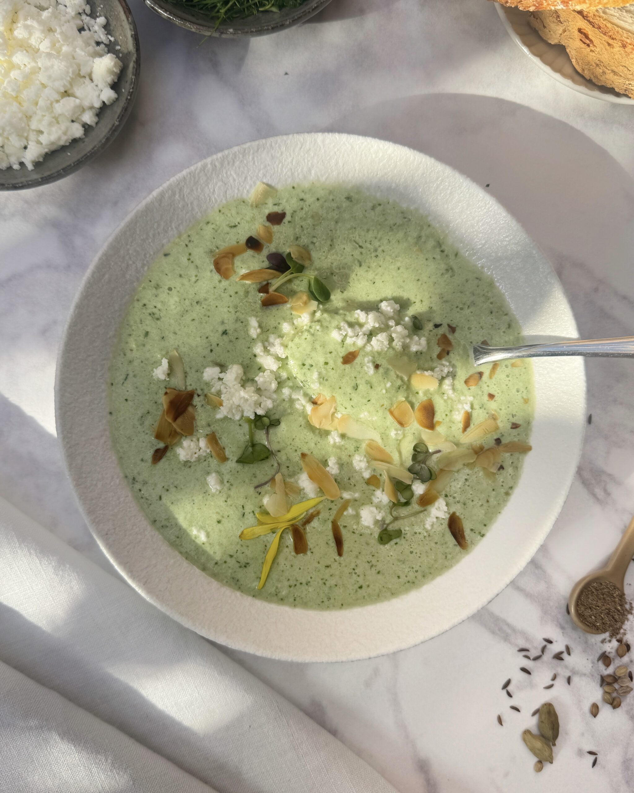 a plate with light green cucumber gazpacho