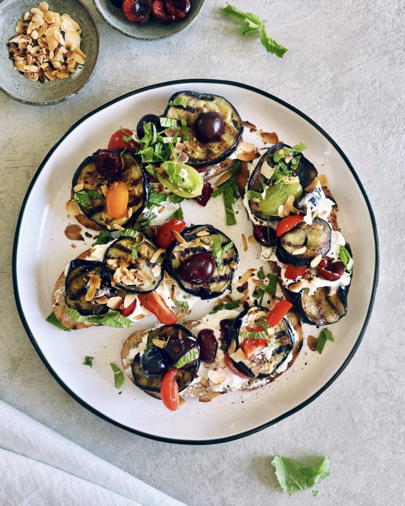 sourdough toast with fried eggplant, marinated cherries and burrata