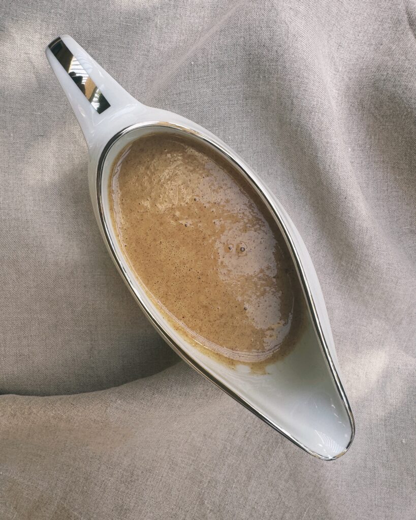 a jar with almond butter sauce